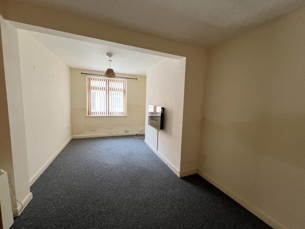 Lot: 93 - COTTAGE FOR REFURBISHMENT - General view of the front living room of property